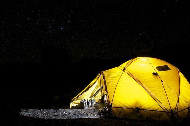 Yellow Tent with a light at night